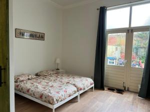 Postel nebo postele na pokoji v ubytování Achterom B & B