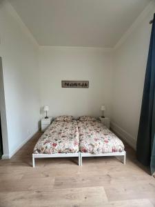 Postel nebo postele na pokoji v ubytování Achterom B & B