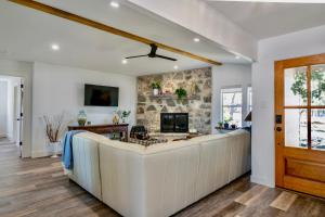 a living room with a couch and a fireplace at Ranchview Retreat in the heart of Johnson City in Johnson City