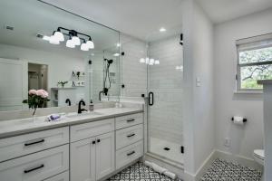 a white bathroom with a sink and a shower at Ranchview Retreat in the heart of Johnson City in Johnson City +46 photos