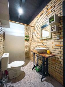 a bathroom with a sink and a toilet at Nostra Habitazione in Ascurra