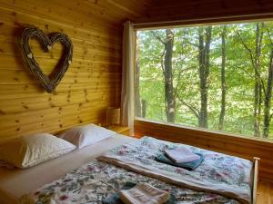 Postel nebo postele na pokoji v ubytování Kerca Bio Farm