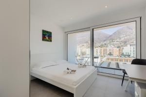 Letto o letti in una camera di Campus Lugano 45 wonderful Smart Suites in the university area
