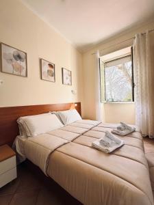 A bed or beds in a room at Hotel Villa Robinia