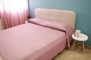 Ένα ή περισσότερα κρεβάτια σε δωμάτιο στο Sibilla Vacanze