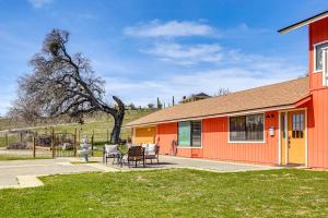 an orange house with a table and chairs in front of it at Pleasant Valley Wine Trail Home - Near Paso Robles in San Miguel