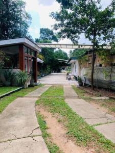 an empty sidewalk in front of a building at Ago Hotel and Villa in Katunayake