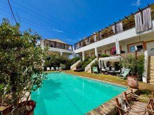 an image of a swimming pool in a house at Irene's Maisonette at Rafaella Resort in Kokóni