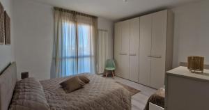 Ένα ή περισσότερα κρεβάτια σε δωμάτιο στο Casa Lucrezia