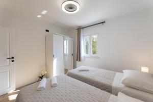 Ένα ή περισσότερα κρεβάτια σε δωμάτιο στο Domus Solis apartment