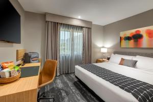 Postel nebo postele na pokoji v ubytování Olivia Hotel