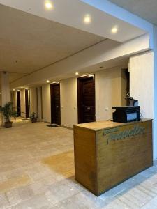 a lobby with a reception desk in a building at Traveller Namma bay in Sharm El Sheikh +22 photos