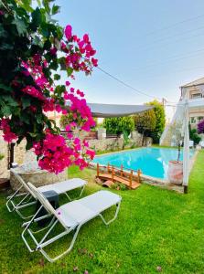 The swimming pool at or close to Michaella's Maissonete at Rafaella Resort