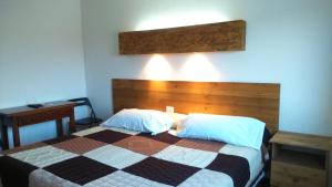 A bed or beds in a room at La Masia