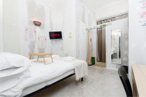 a bedroom with a bed with a table on it at Centro Torino - Chambre Victoria - by Cesare Marretti in Turin