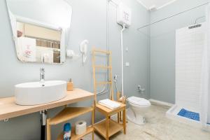 a bathroom with a sink and a toilet at Centro Torino - Chambre Victoria - by Cesare Marretti in Turin