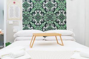 En eller flere senge i et værelse på Centro Torino - Chambre Victoria - by Cesare Marretti