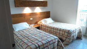 A bed or beds in a room at La Masia Még 37 kép