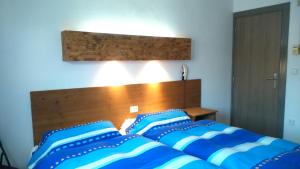 A bed or beds in a room at La Masia