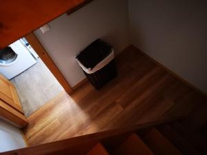 an overhead view of a laundry room with a trash can at Mayen La Grangette, bulle d'évasion in Nendaz
