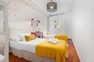 En eller flere senge i et værelse på Mara Arenal Sevilla