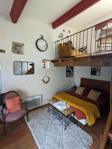 a bedroom with a bunk bed and a staircase at Le Mas Bellane in Salettes