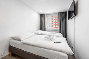 Postel nebo postele na pokoji v ubytování Apartments Kolín & Penzion Navara