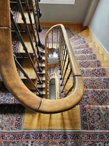 a spiral staircase in a room with a rug at Studio Cœur de Deauville à 10 minutes à pied de la plage in Deauville +1 photo