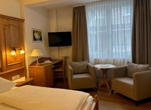 TV a/nebo společenská místnost v ubytování Seehotel Schäpfle