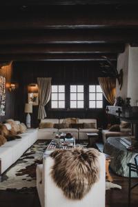 a large living room with couches and a table at Chalet de Luxe Saint Gervais avec Vue ,Spa, Jacuzzi, Salle de sport in Saint-Gervais-les-Bains +63 photos