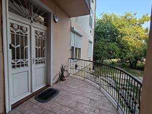 a front door of a house with a balcony at Rom Apartman in Budapest