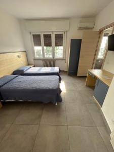 Postel nebo postele na pokoji v ubytování Hotel Marchina