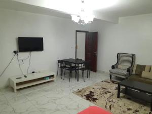 TV a/nebo společenská místnost v ubytování Zahra appartement