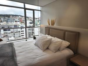 Postel nebo postele na pokoji v ubytování New Coliving Ecuador Luxury Residences + 33 fotografií