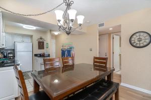 a kitchen and dining room with a table and chairs at Sands Beach Club 922 in Myrtle Beach
