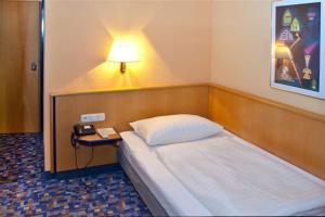 Posteľ alebo postele v izbe v ubytovaní Hotel Strohofer