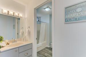 a bathroom with a sink and a large mirror at Gorgeous Chic Beach Front Condo 2775 in Traverse City