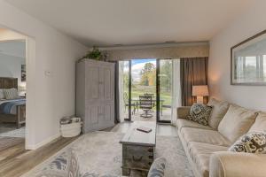 a living room with a couch and a table at Gorgeous Chic Beach Front Condo 2775 in Traverse City +19 photos