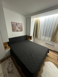 Postel nebo postele na pokoji v ubytování Royal Gold & Spa Kop