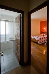 an open door to a bedroom with a bed at Hostal Ayestaran I in Lekunberri