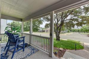 a blue rocking chair on a porch with a tree at 3BR family home with backyard in Austin