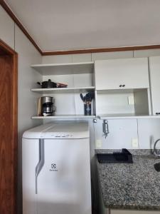 Kuchyň nebo kuchyňský kout v ubytování Apart Hotel Champagnat UN1206