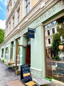 a store with a sign in front of a building at RELAXED LIVING No 02 Historic Oslo in Oslo
