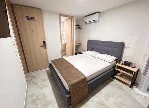 Katil atau katil-katil dalam bilik di Hotel Plaza Mayor Itagui