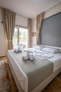 Ένα ή περισσότερα κρεβάτια σε δωμάτιο στο PrimeStay Tirana Apartments