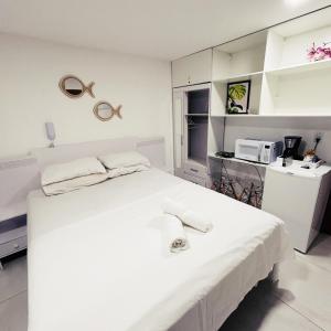 En eller flere senge i et værelse på Paradise Flat 107 + 6 billeder