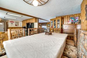 a dining room with a table and chairs at Tranquil Ranch Home on 10 Acres in Leavenworth! in Leavenworth