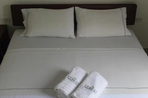 Postel nebo postele na pokoji v ubytování Hotel Preferencial Class