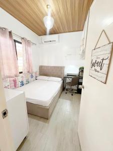 Ένα ή περισσότερα κρεβάτια σε δωμάτιο στο Eco's Place GenTri - Family Bungalow
