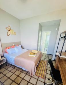 a bedroom with a bed and a desk and a chair at DMCeara Golden Fortaleza - Praia in Fortaleza +28 photos